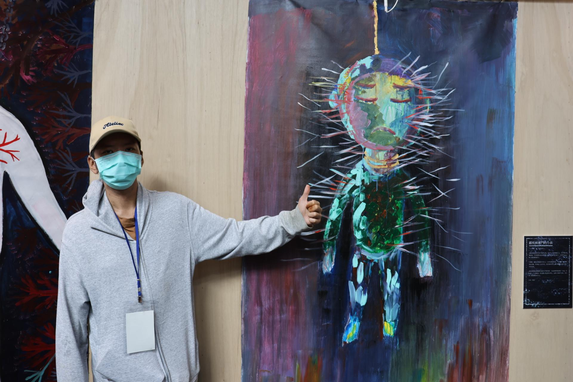 活泉之家會員鄭彥為展覽主視覺創作者，以「揭開心底的針」，將內心隱痛化為視覺符號。